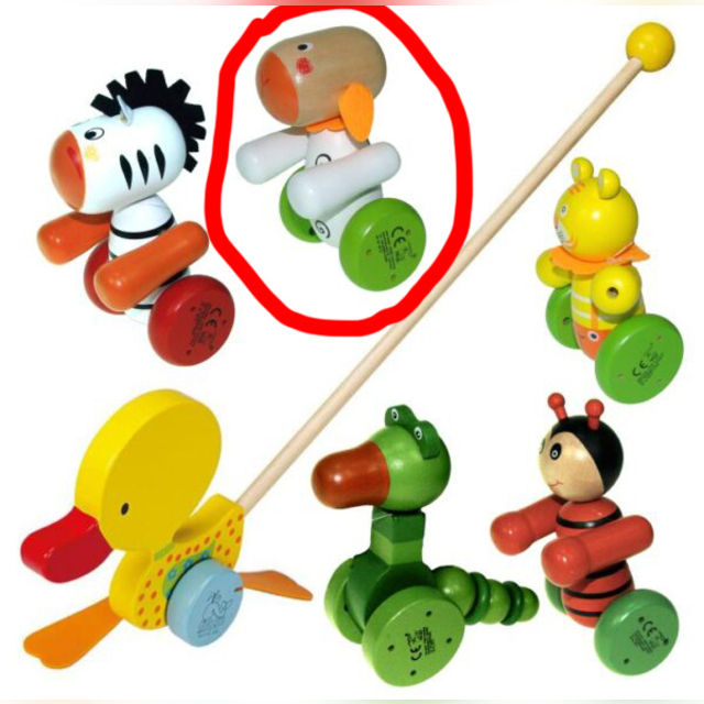 A wooden sheep with a push stick - a pusher