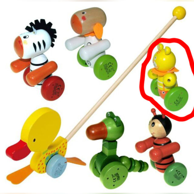A wooden lion with a push stick - a pusher